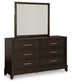 Neymorton King Upholstered Panel Bed with Mirrored Dresser and Nightstand